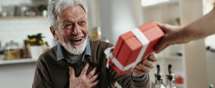 Elder opening presents during the holiday season